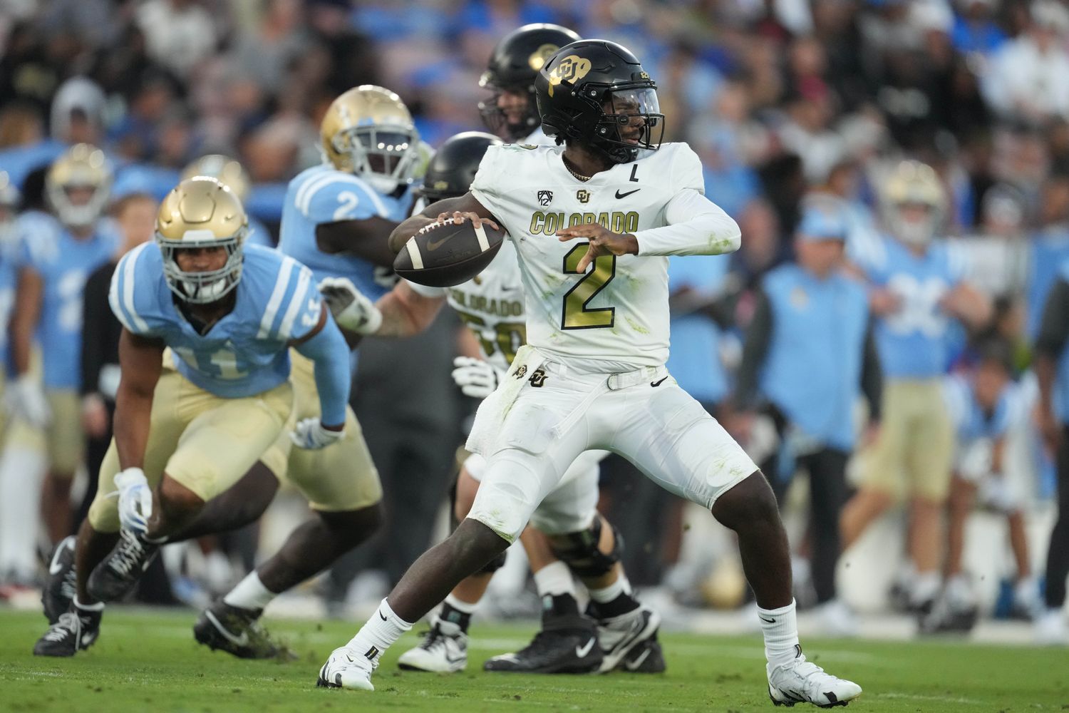 Colorado Buffaloes quarterback Shedeur Sanders (2) throws the ball against the UCLA Bruins in the first half at Rose Bowl